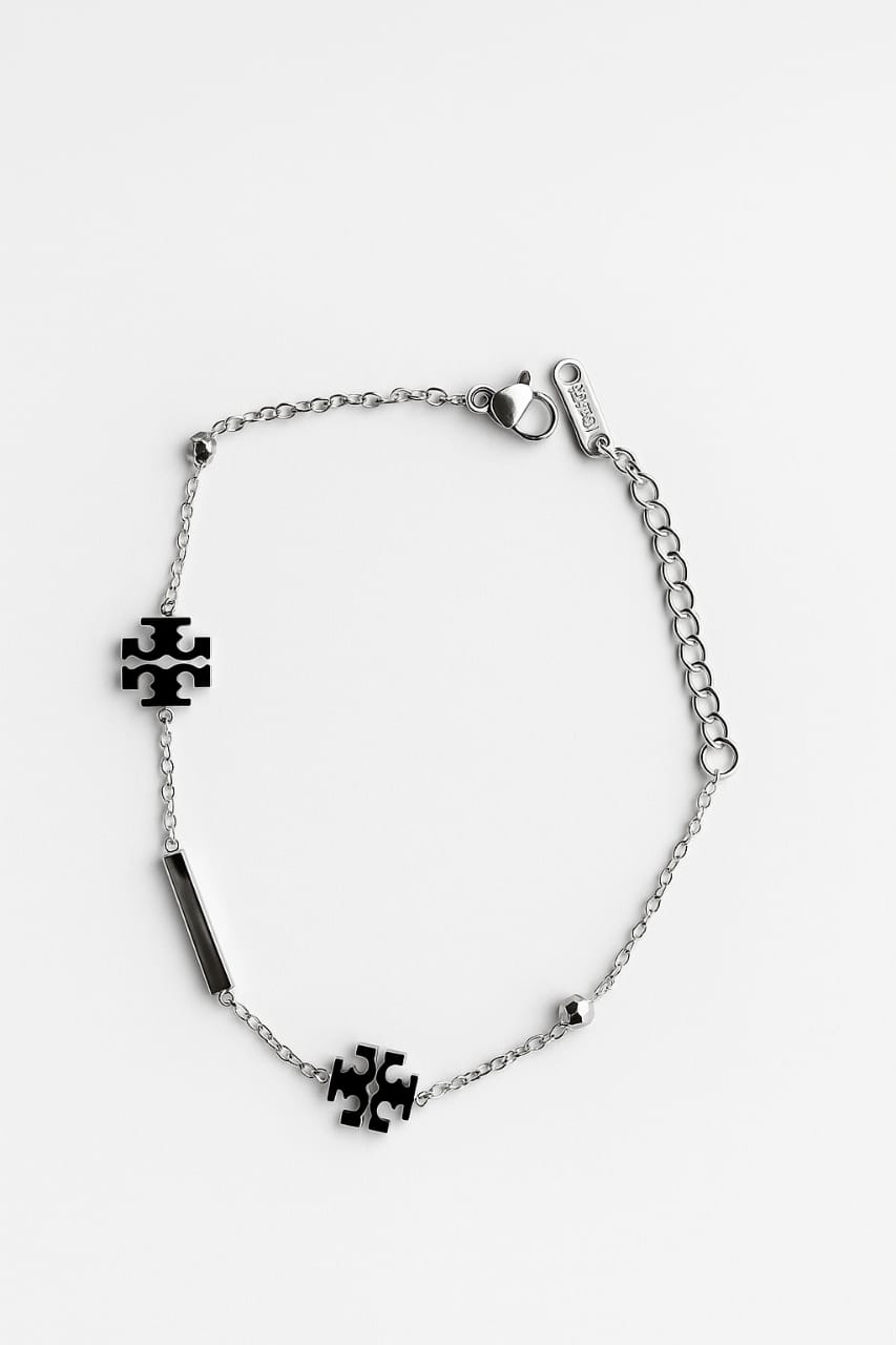 Silver bracelet with puzzle piece charms